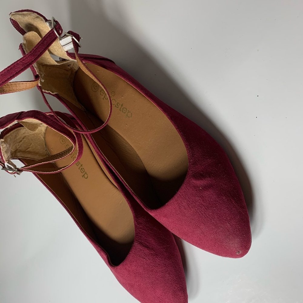 Woman’s burgundy strappy sandals